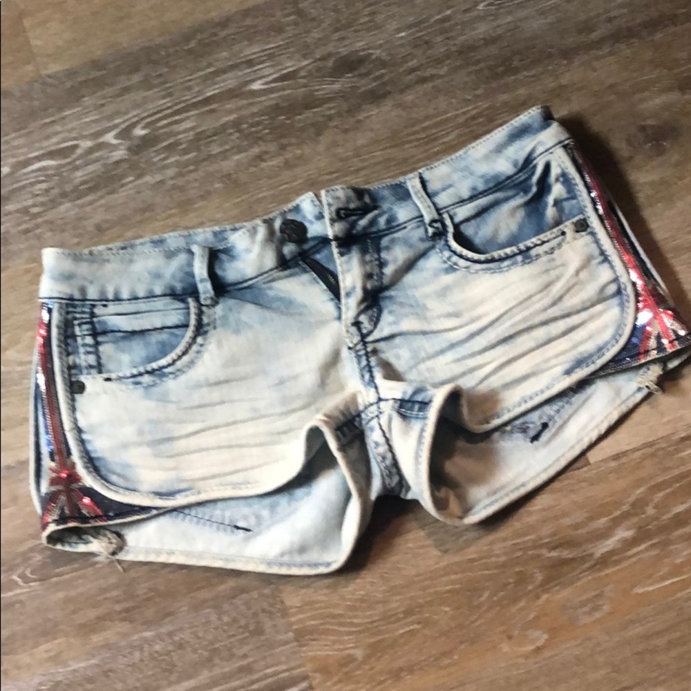 Women’s acid wash shorts with British flag sequins